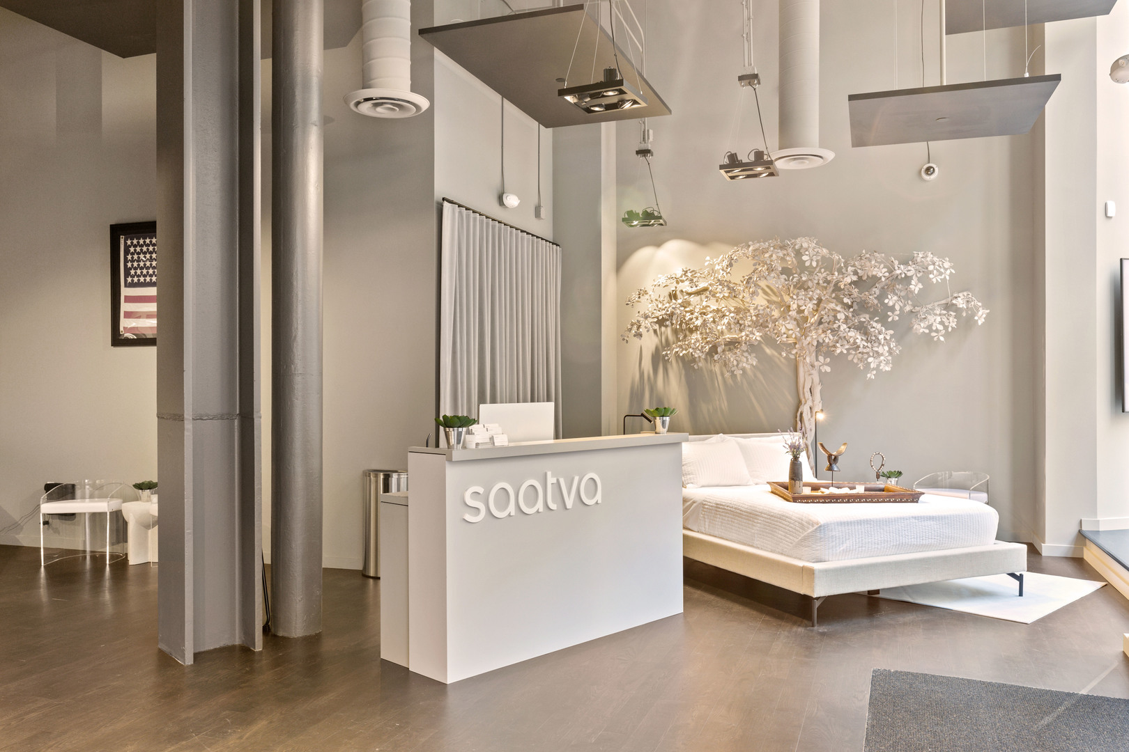 Saatva SF Interior with Tree and Check In Desk Closeup SlavaBlazerPhotography